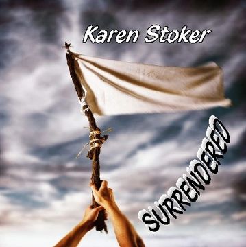 Hands holding a white flag with words 'Karen Stoker' and 'SURRENDERED'.