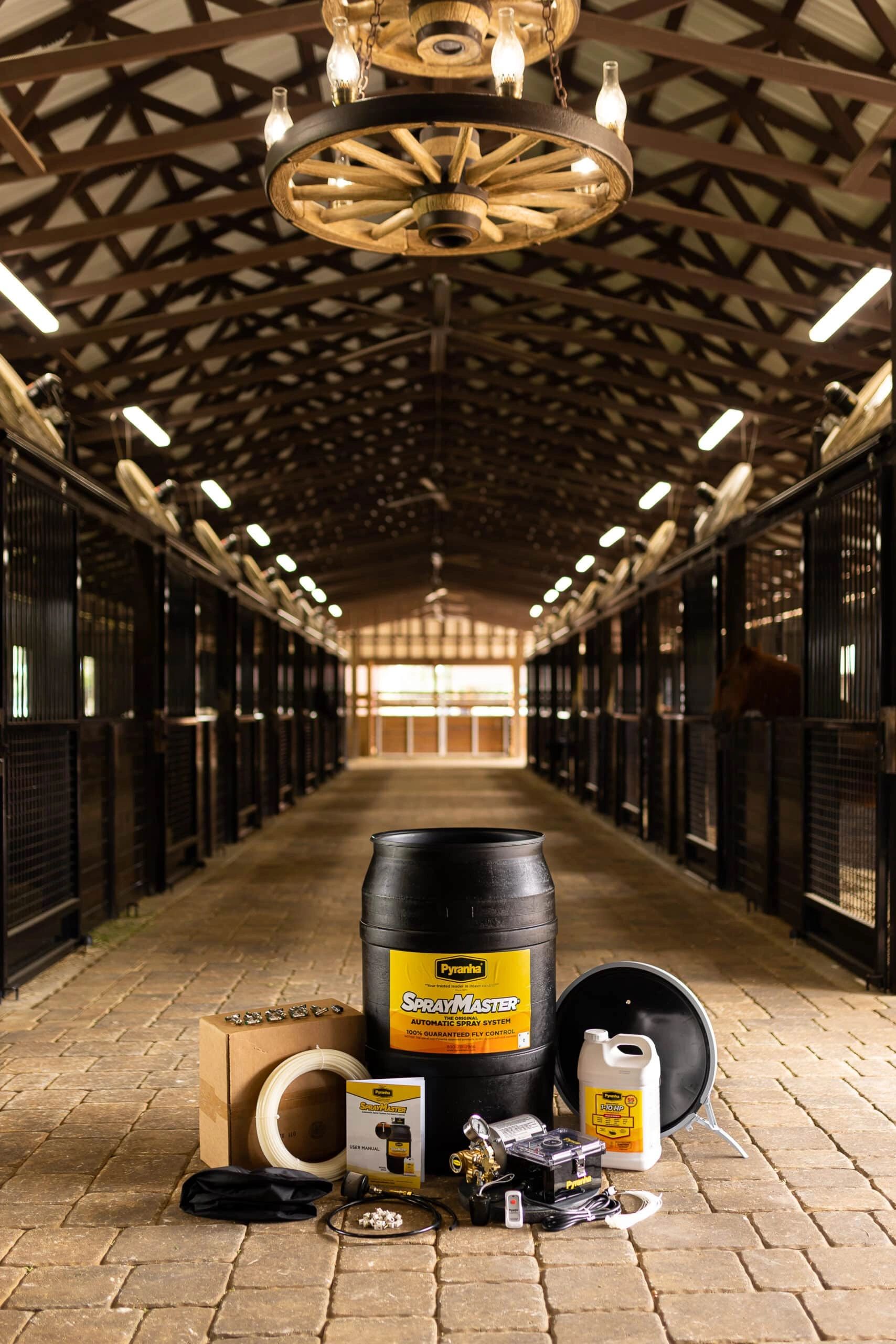 Pyranha SprayMaster insect control system in a stable.