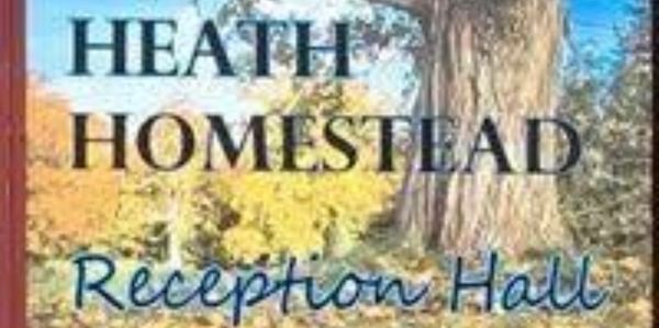 Sign for Heath Homestead Reception Hall with autumn background.