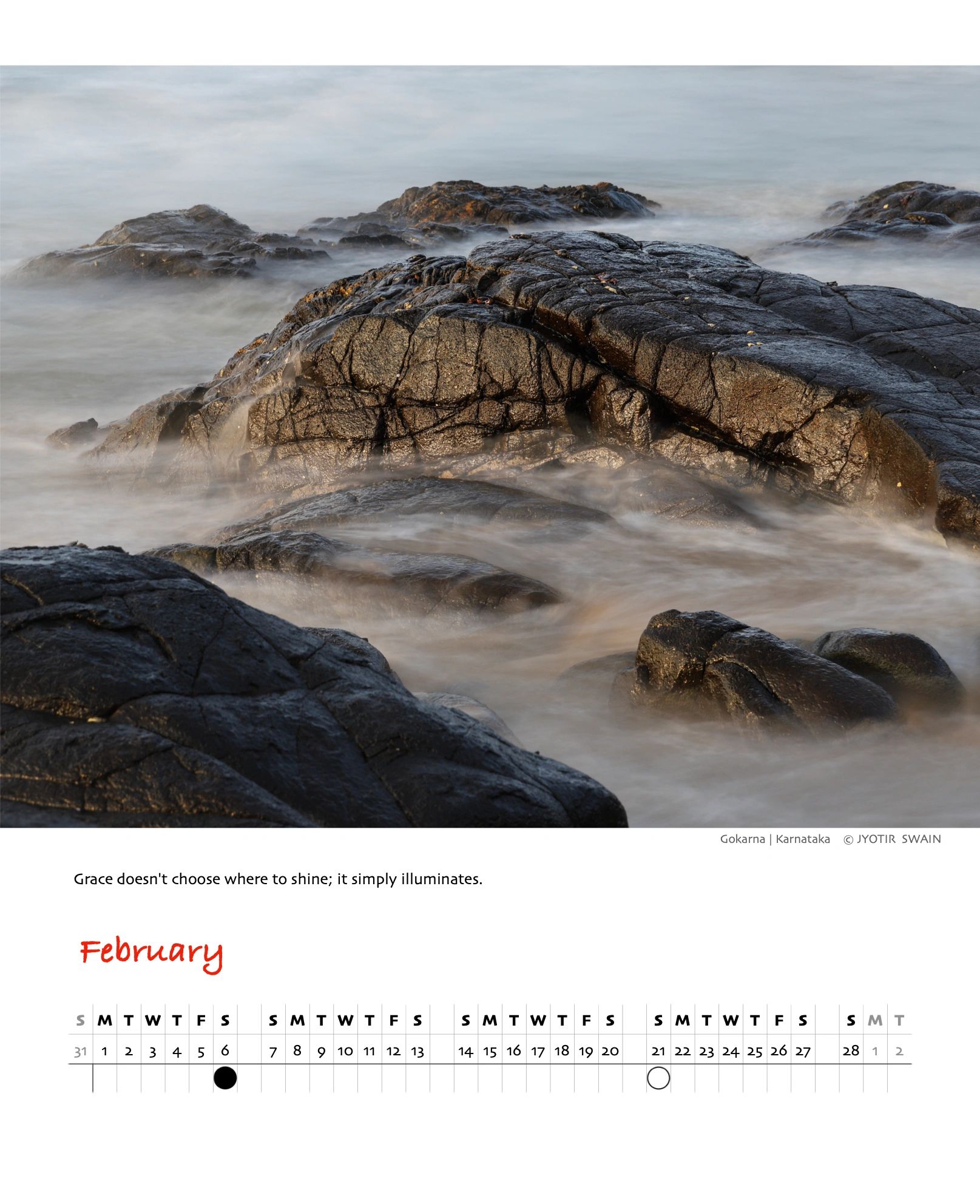 Rugged rocks surrounded by misty water at Gokarna, Karnataka.
