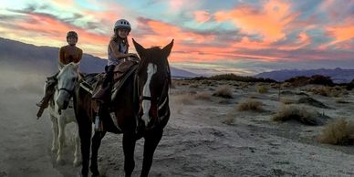 Kids riding during sunset.