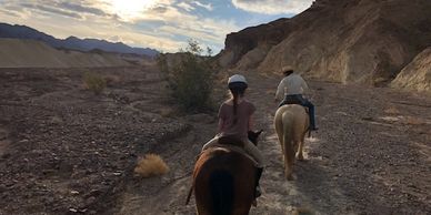 A young rider heading up Furnace Creek wash horseback.