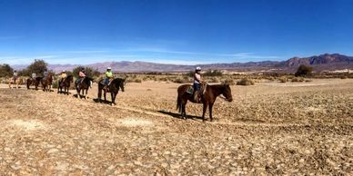 Riders on the valley floor.