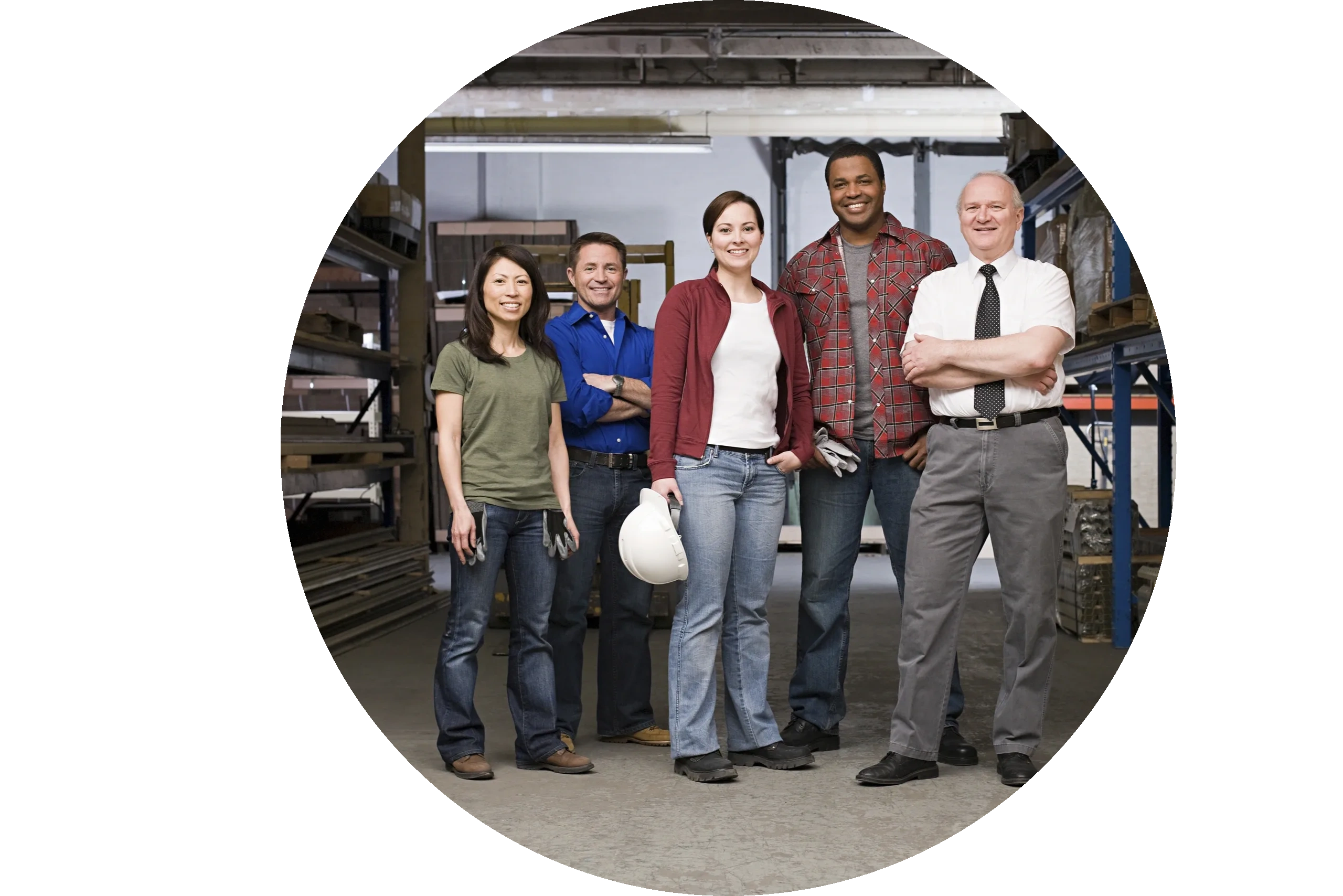 Group of people smiling in an industrial work setting 