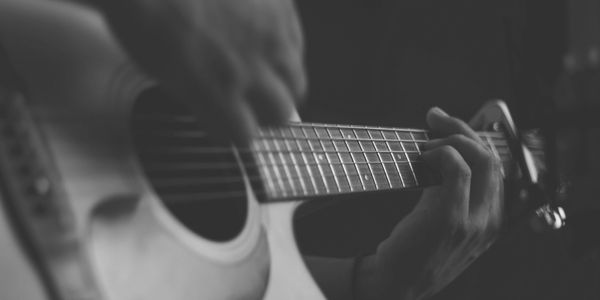 Person playing guitar