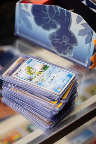 Stack of Japanese pokemon cards in toploaders