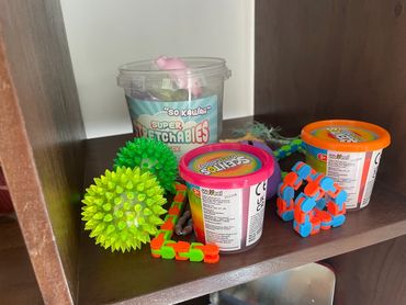 Collection of fidget toys and objects used in counselling therapy to help  clients self-regulate 