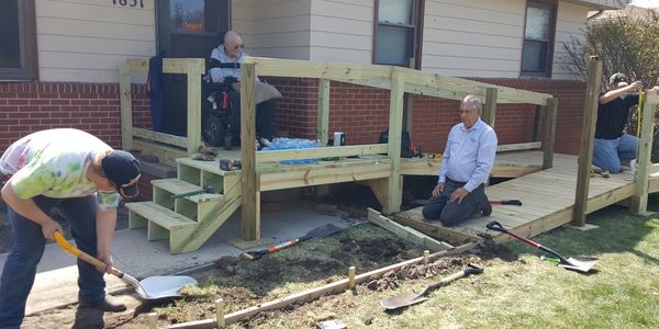 Workers building wheelchair-friendly staircase