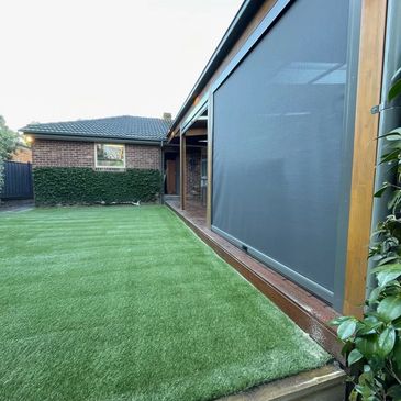 Synthetic turf against a merbau deck