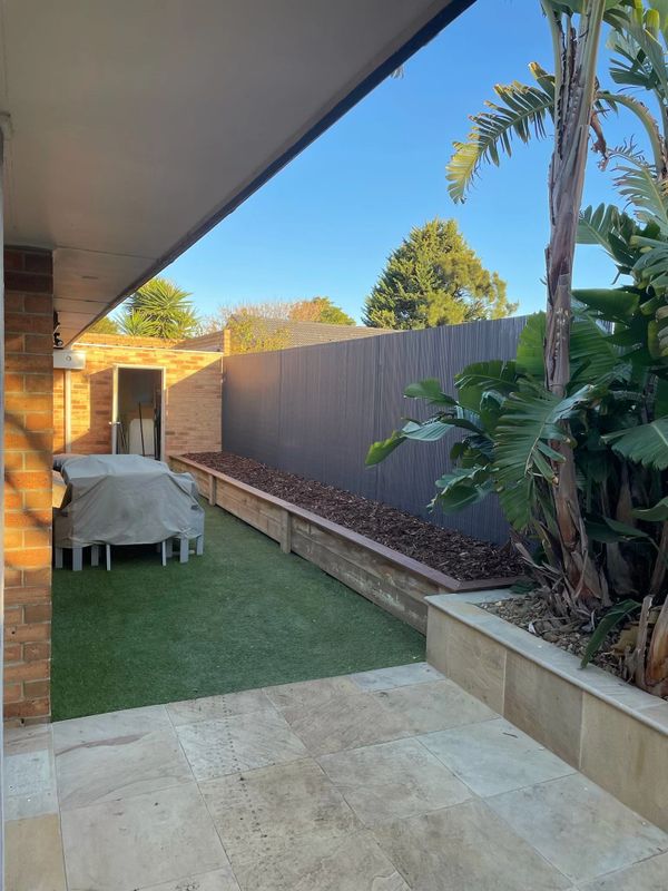 Raised garden bed with Merbau Capping and Bamboo fence screen