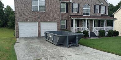 10 yard dumpster in driveway unloaded
