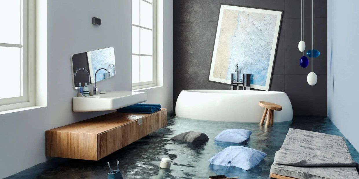 Modern bathroom with flooded floor and floating furniture.