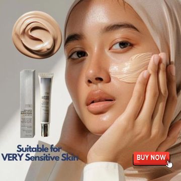 Women's face with a streak of cream SPF50 sunscreen