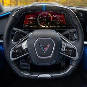 Steering wheel and dashboard of a Corvette sports car.