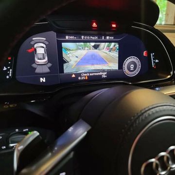 Audi dashboard with rear view camera display.