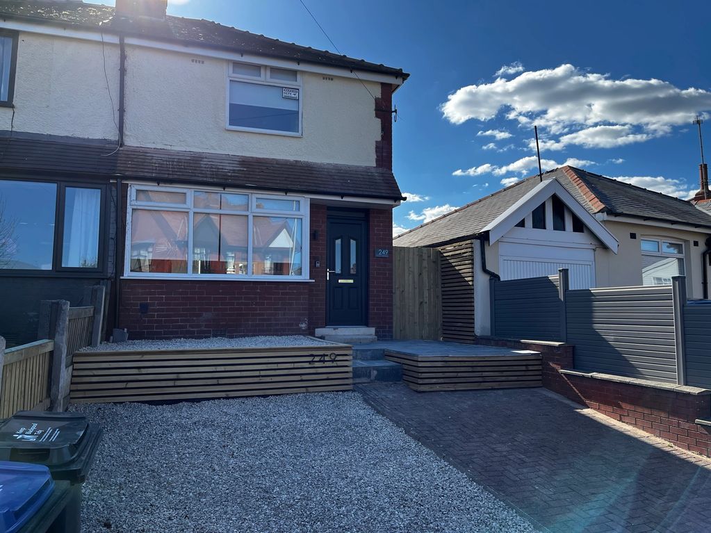 gravel drive and modern fencing to improve the front of the house