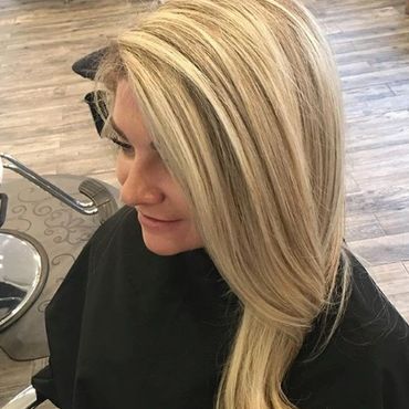 Woman with blonde highlights and bob.