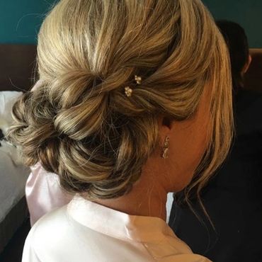 Woman with an updo hairstyle.