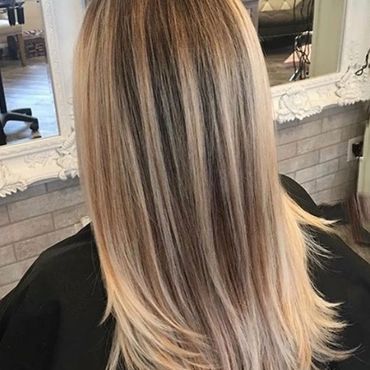 Woman with straight blonde hair.