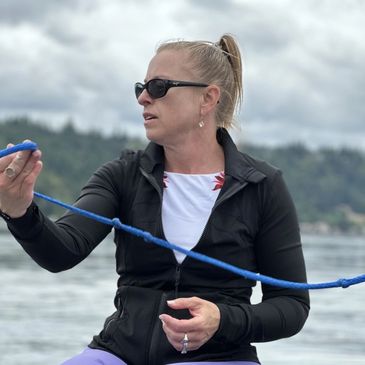 Sarah Beatie coaching a wake surfing lesson on Lake Sammamish in partnership with Sisters In Action Sports.