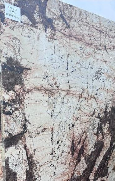 Large slab of marble with intricate brown and black veining patterns.