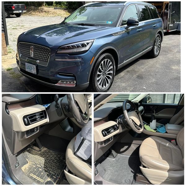 Blue luxury SUV with clean interior and leather seats.