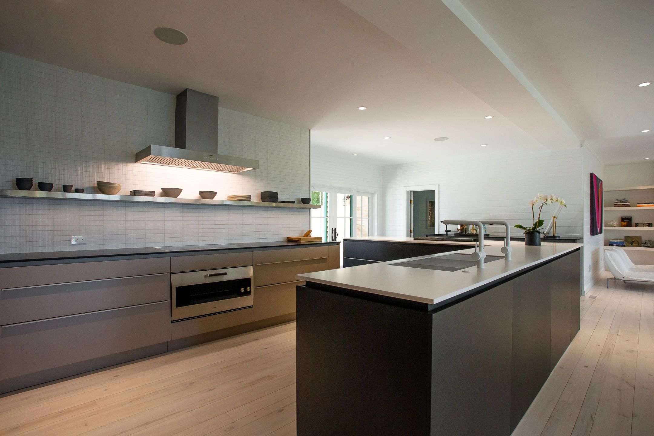Modern kitchen with sleek design and soft lighting.