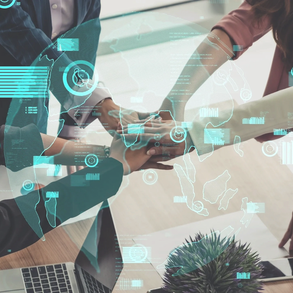 Team collaboration with a digital globe and data overlays.