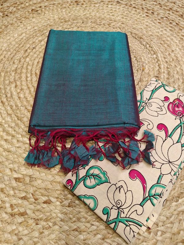 Folded blue silk cloth with tassels and floral pouch.