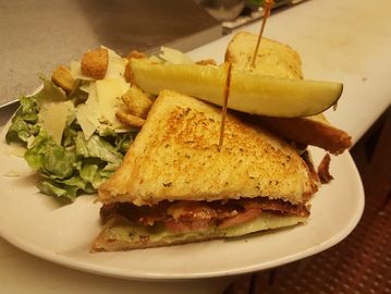 A blt sandwich and salad on a plate
