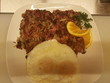 Corned beef hash and eggs on a plate