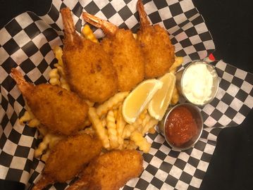 Jumbo Prawns and french fries in a basket