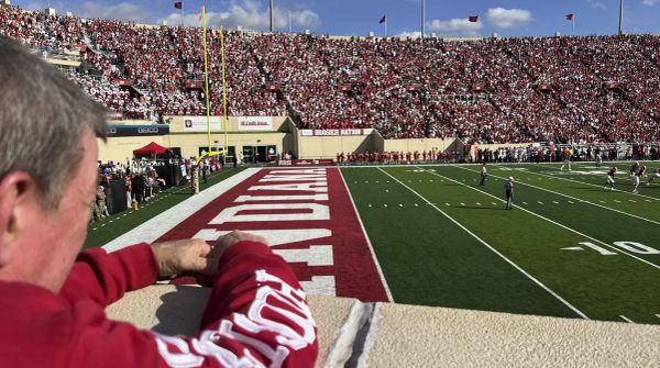Fan watching a football game at the Indiana stadium.
