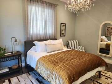 1 queen bedrooms with separate access to large shared bathroom. 2 sinks with separate private shower