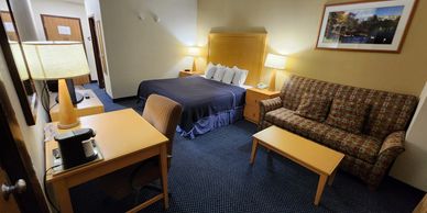 Standard Hotel Room with one king bed and one sleeper sofa at Katahdin Inn and Suites.