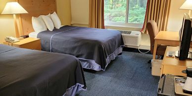 Standard Hotel Room with two double beds at Katahdin Inn and Suites. Sleeps 4.