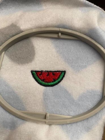 Custom embroidered watermelon on a onsie. 