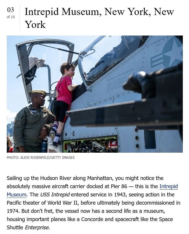A young boy explores a military aircraft cockpit with a guide at the Intrepid Museum.