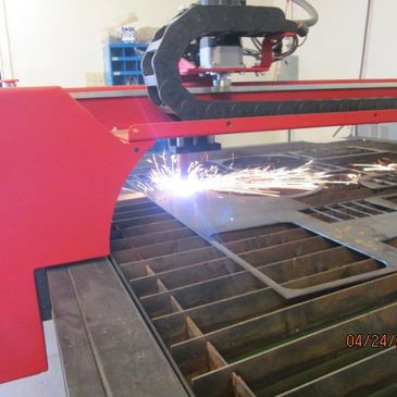 Laser cutter slicing steel plate