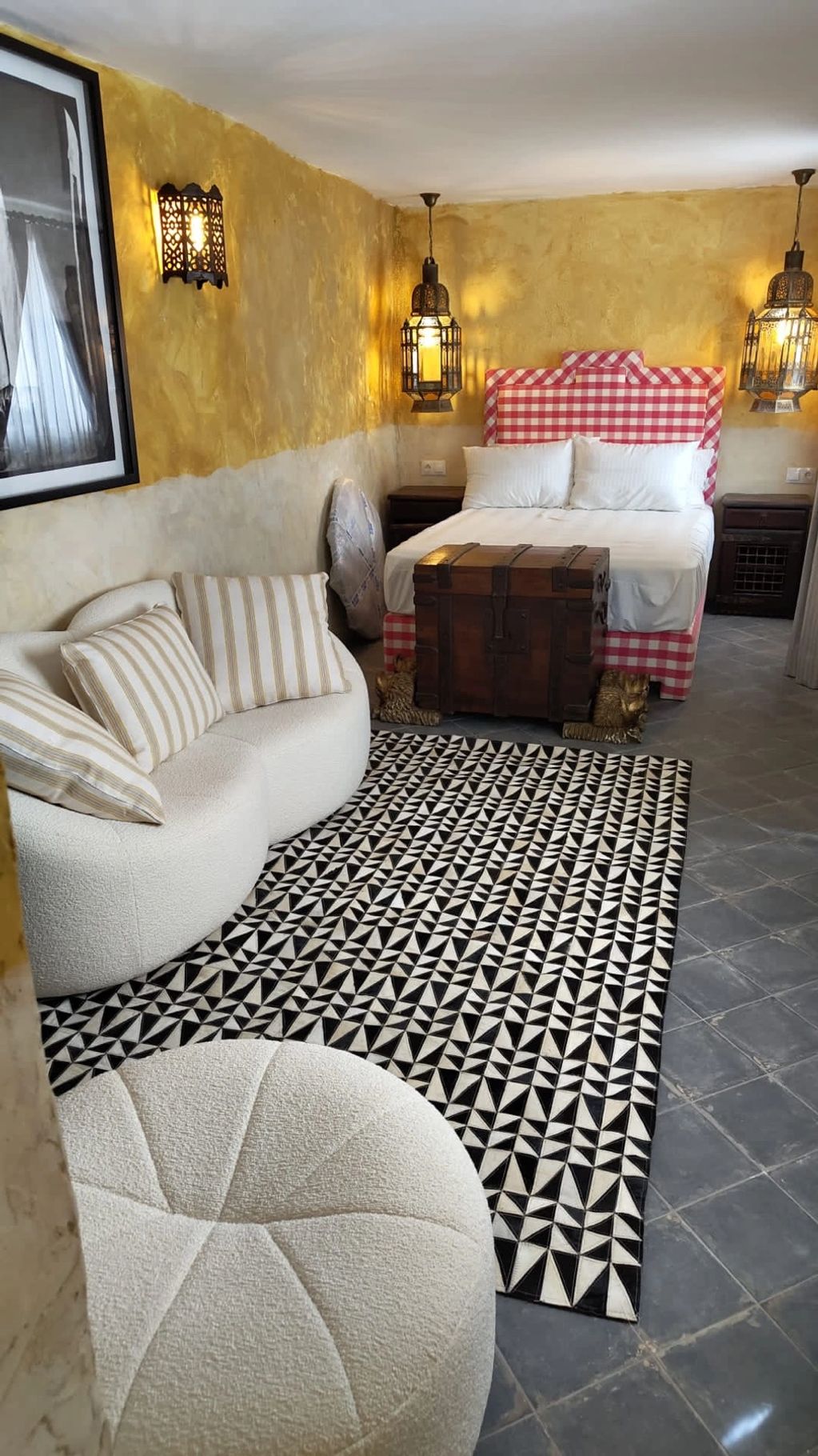 The gold and white themed Cuarto Berber bedroom of Aldeon Luxury Suites