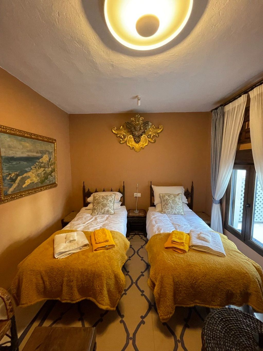 The yellow, tan, and gold colored Cuarto Sevilla room inspired by Seville, Spain