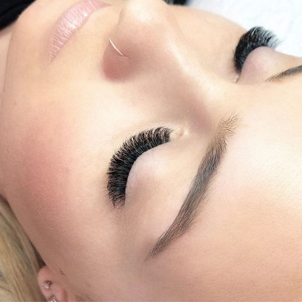 Close-up of eyelash extensions on closed eyes.
