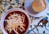 Chili with shredded cheese and a corn muffin