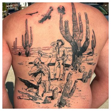 Back tattoo depicting a desert scene with a cowboy and a kneeling figure surrounded by cacti.