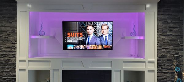LG 55" TV wall mounted on full motion mount
