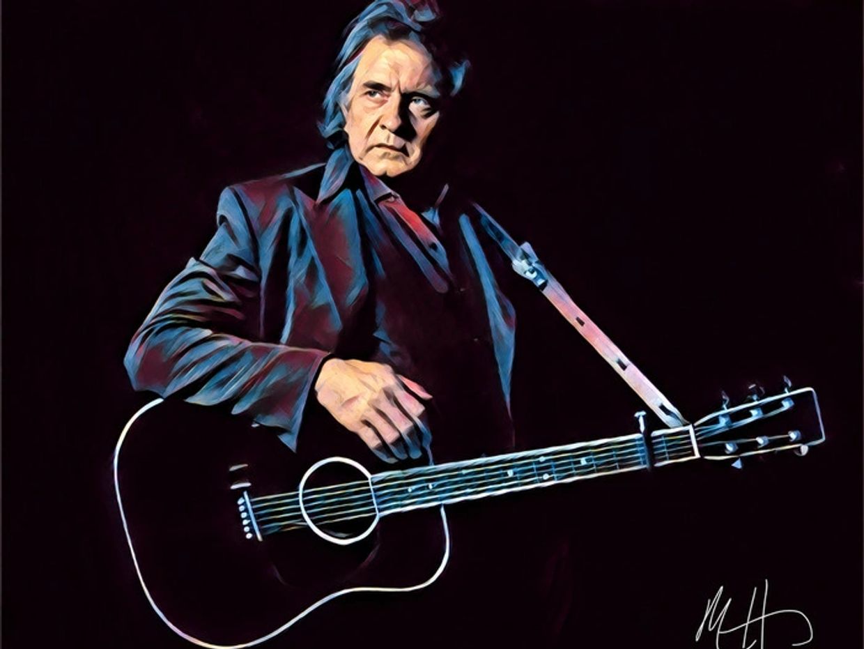 Portrait of a serious man with a guitar.