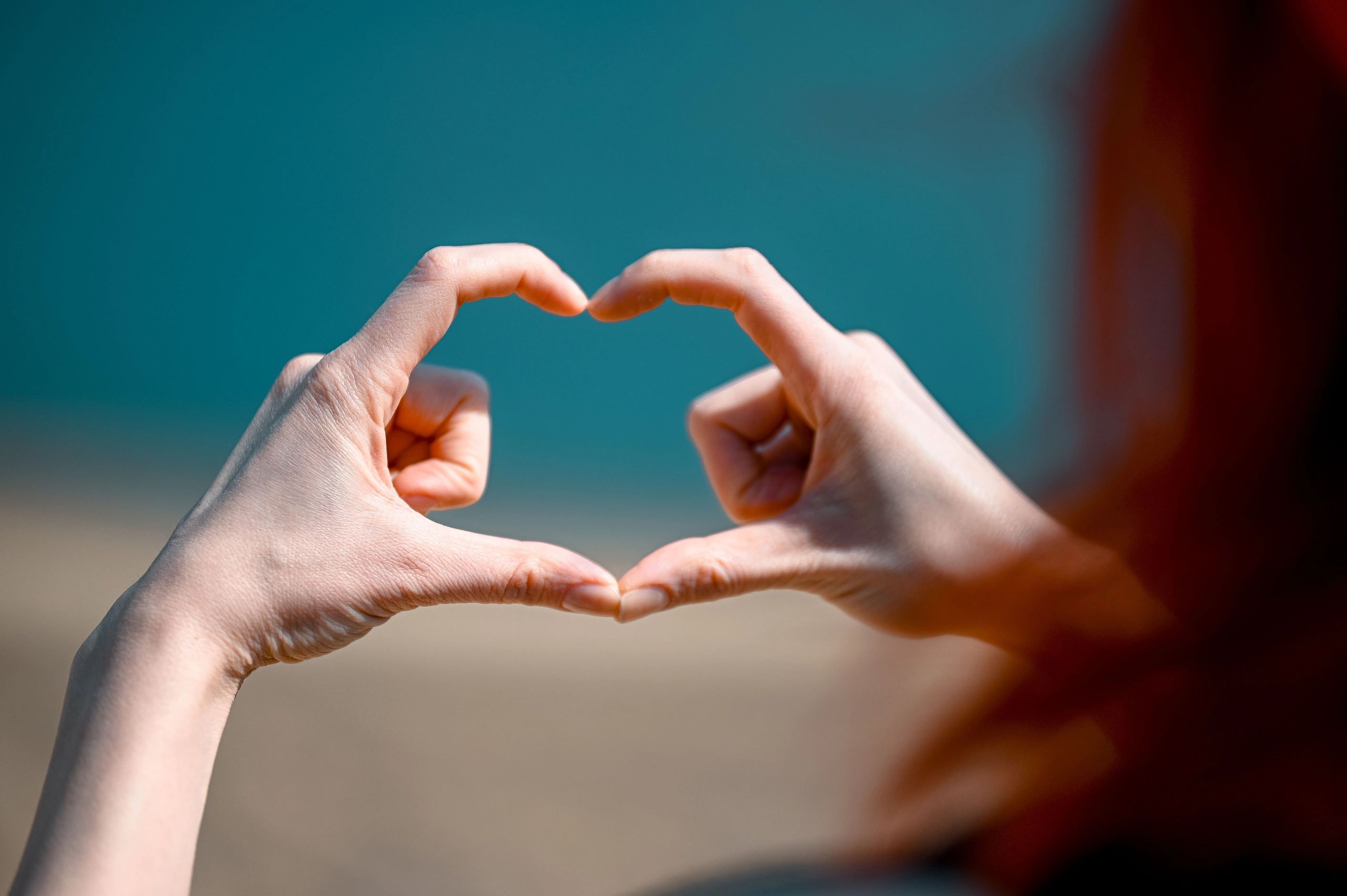 Hands forming a heart shape.