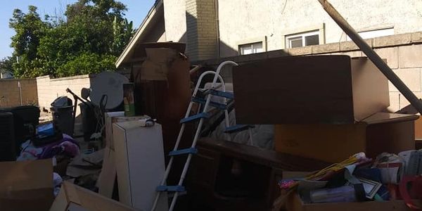 Residential junk removal backyard cleanout.