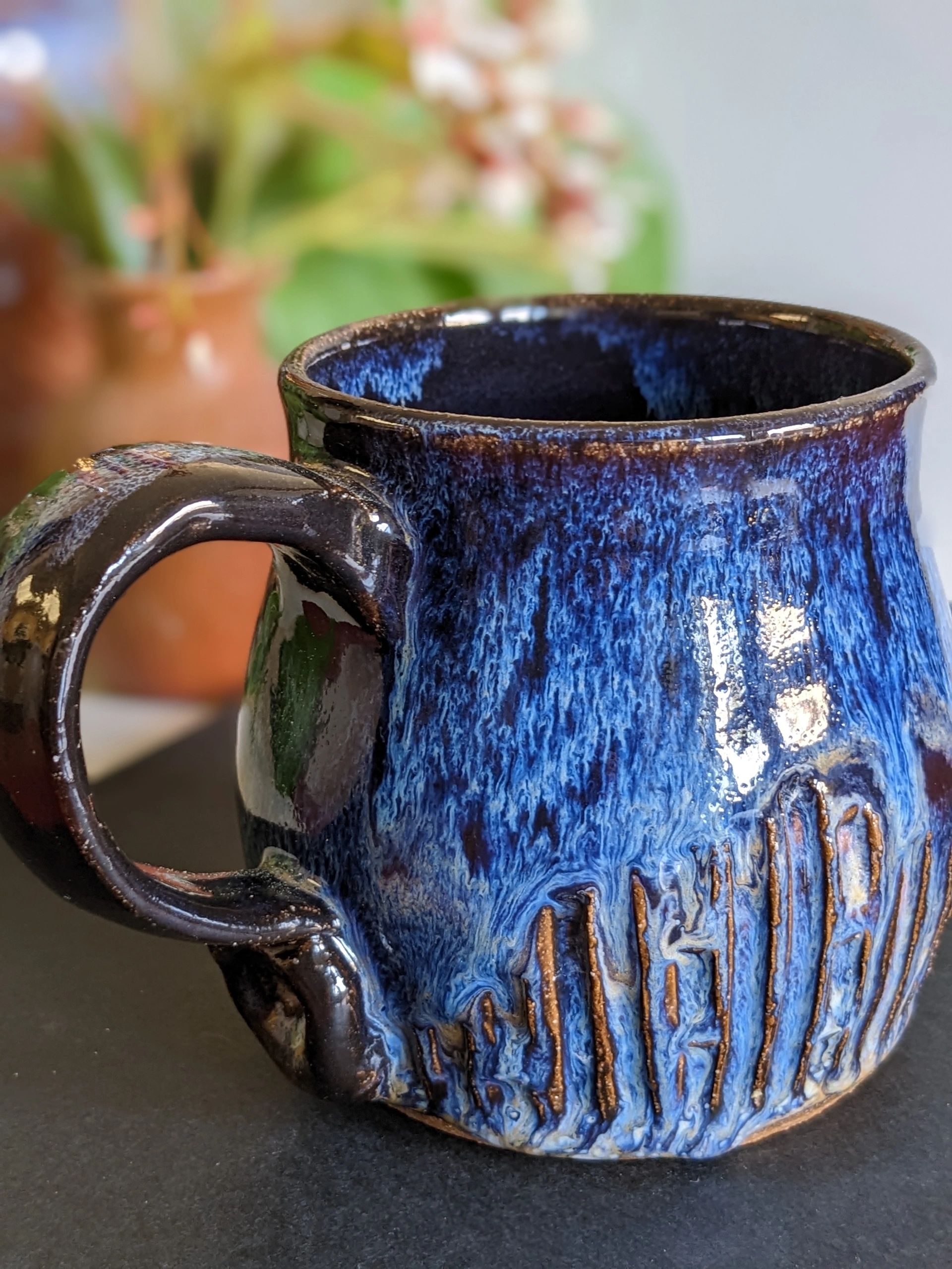 Handmade mug using Amaco Indigo Float and Mayco Light Flux.