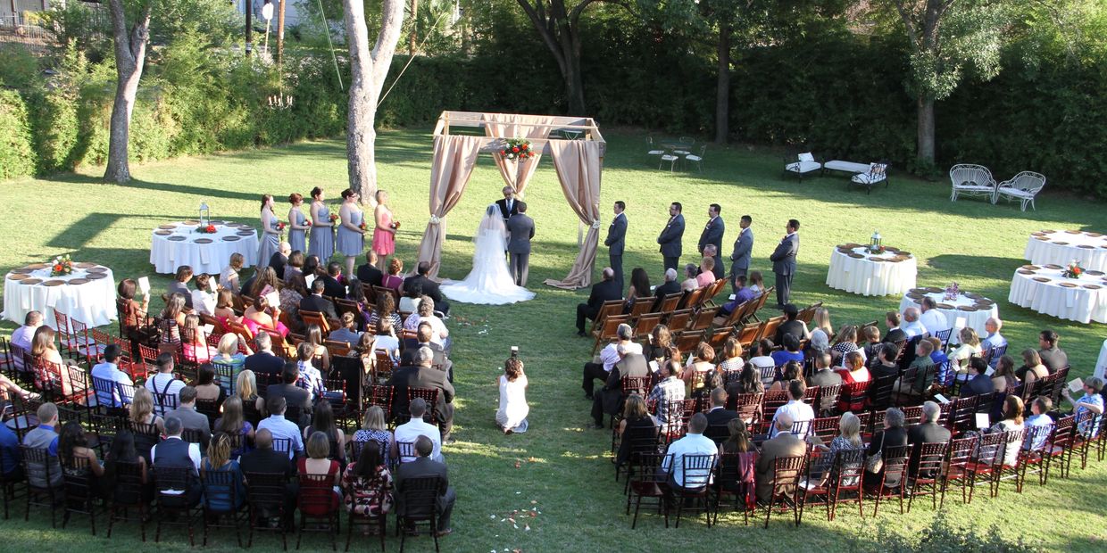 A beautiful ceremony under a decorated gazebo in Lambermont's back lawn.